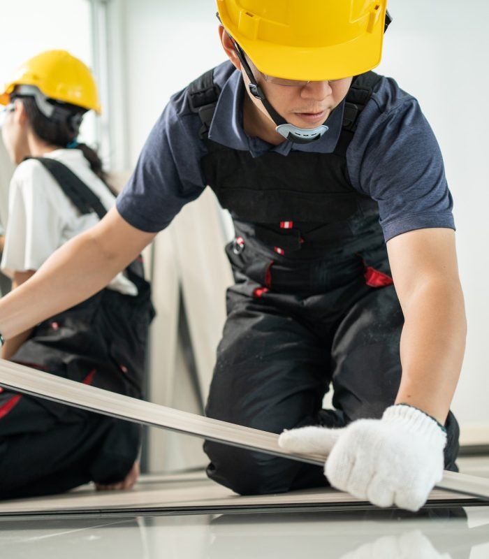 asian-craftsman-worker-man-and-woman-work-by-installs-laminate-board-on-floor-to-renovating-house-.jpg